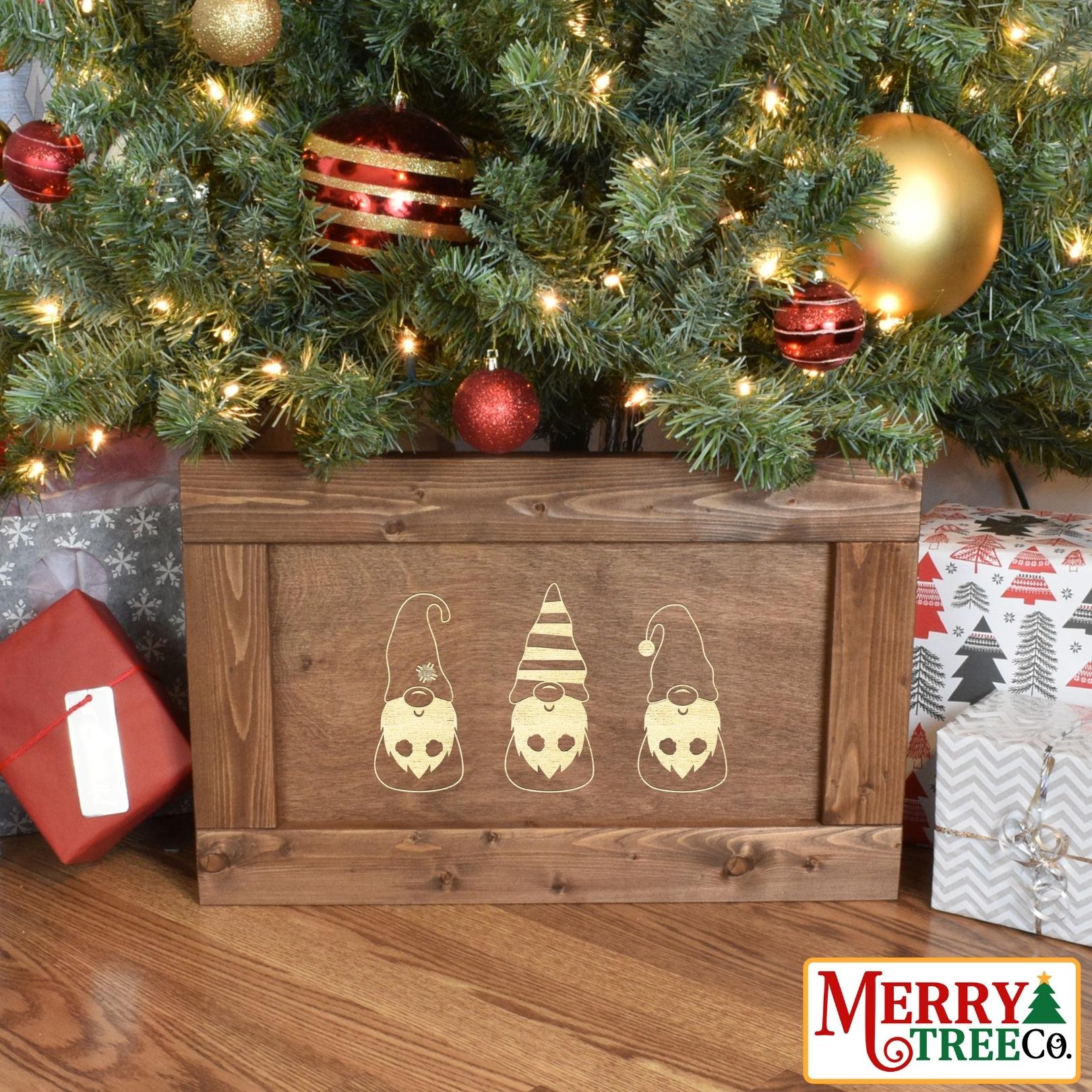 Light brown stain picture framed wood tree box with three Christmas gnomes in a row.