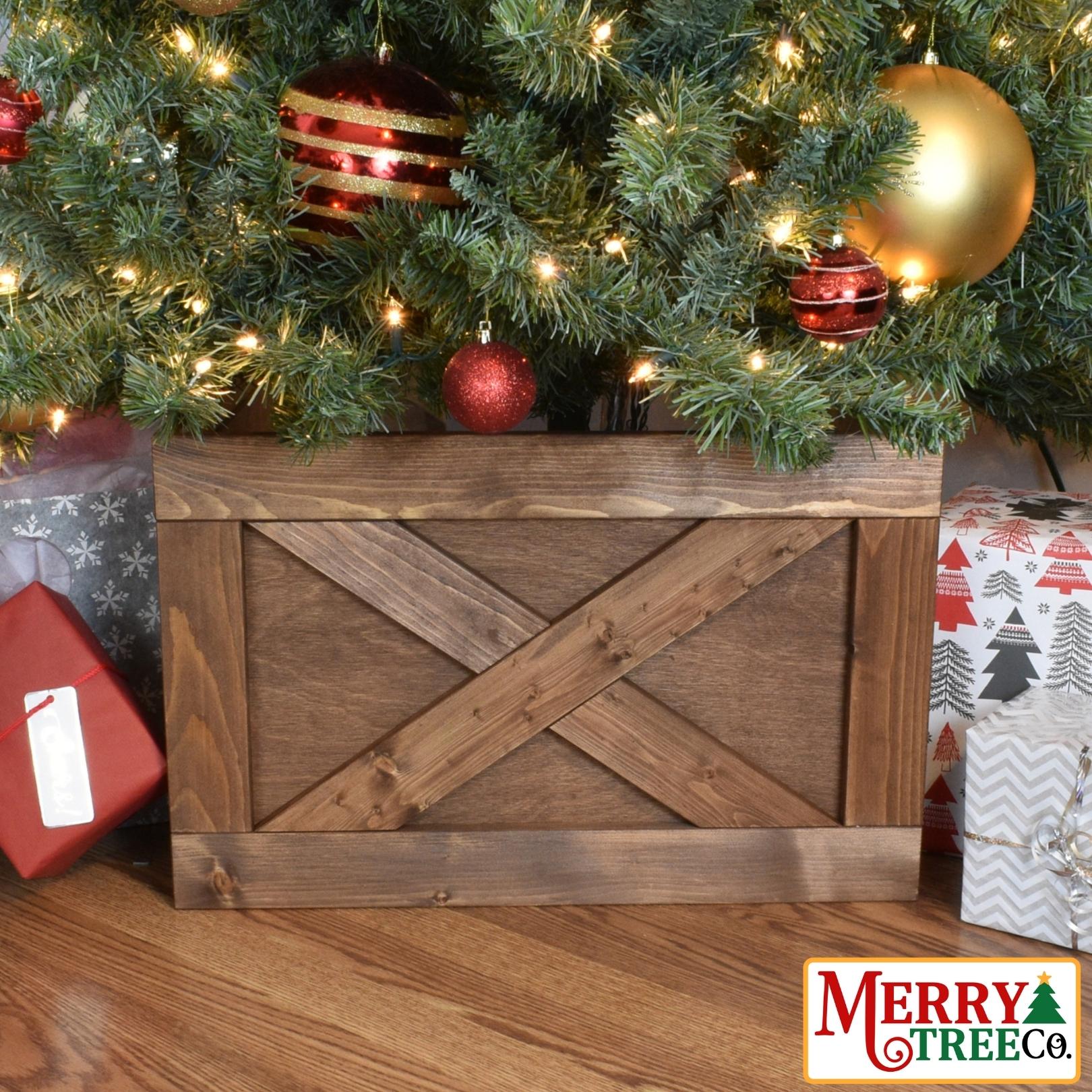 Light Brown stained tree box with picture frame and X design in wood.