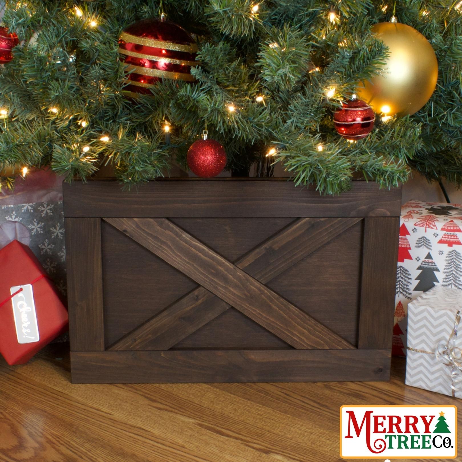 Dark brown stained tree box with picture frame and X design in wood.