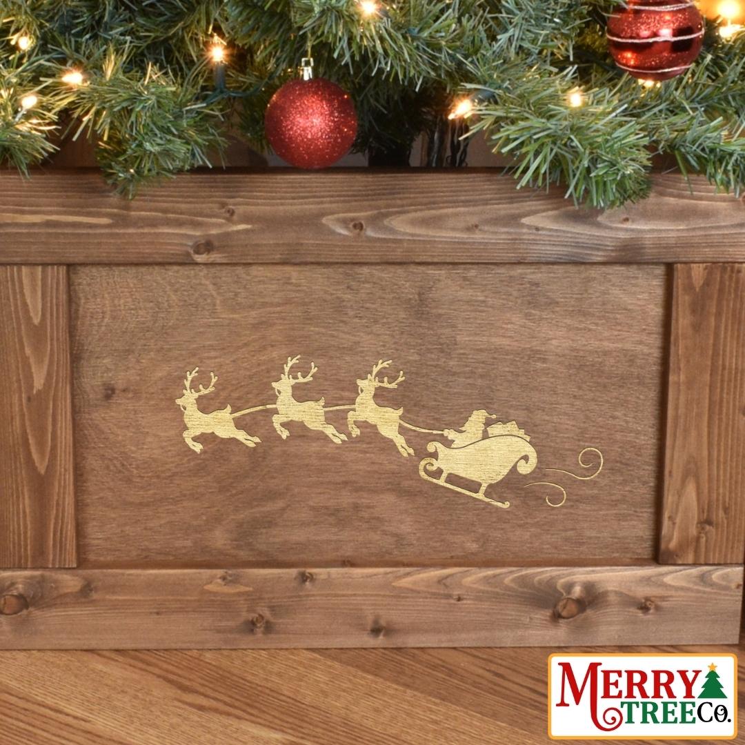 Zoom in on santa's sleigh design on brown wood tree skirt