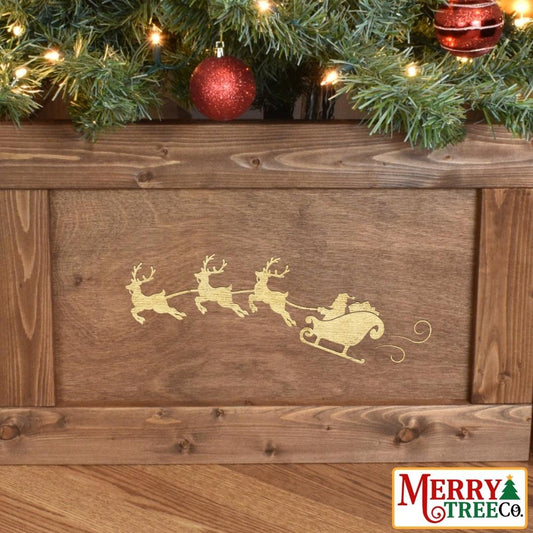 Zoom in on santa's sleigh design on brown wood tree skirt